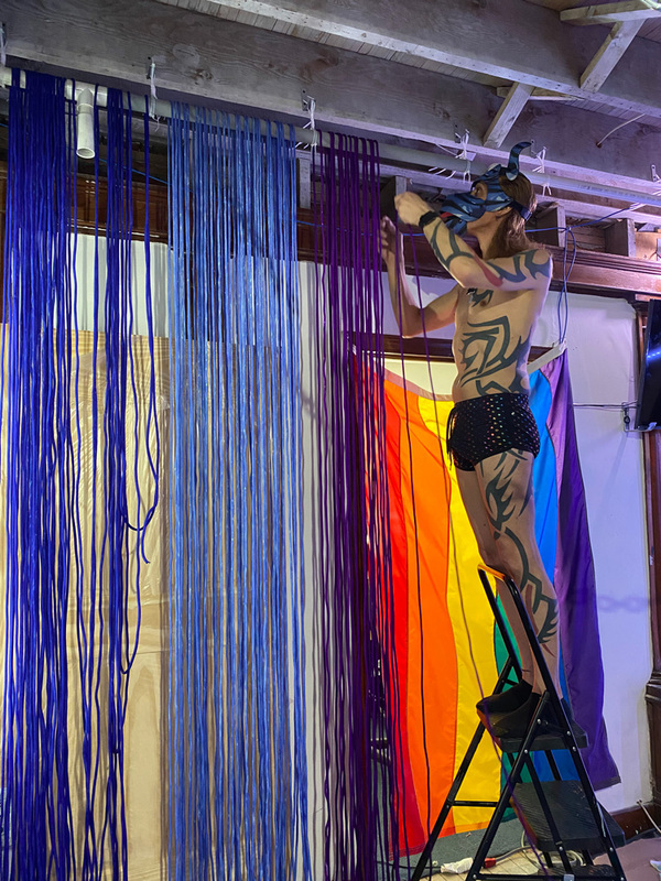 Hanging dyed nylon rope from a bar on the ceiling