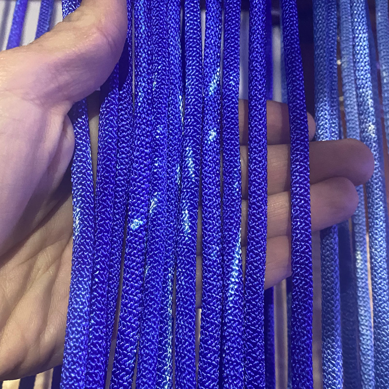 Blue nylon shibari rope with natural color blemishes from the dyeing process